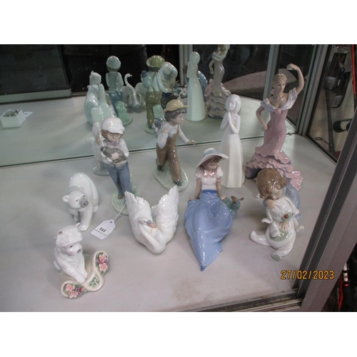 161 - Various figurines and models by Lladro, Nao, Doulton and other makers