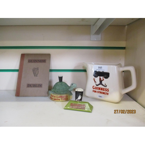 183 - Three pieces of Guinness pub memorabilia together with a Guinness Dublin book