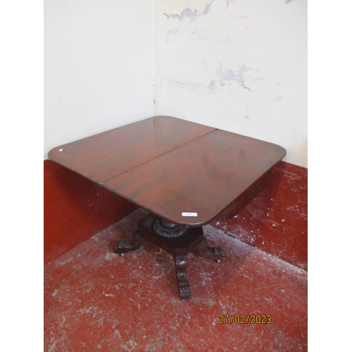 216 - A nineteenth century mahogany tea table with fold over top