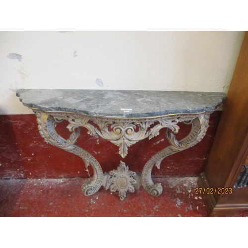 217 - A highly ornate gilded and marble top console table