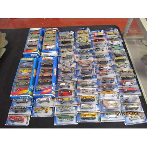 233 - Sixty Hotwheels diecast model cars together with four similar gift sets - all new and carded