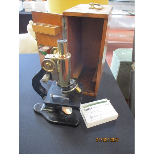 261 - A vintage laboratory telescope by Messrs. C Baker of London complete with a range of select micro sl... 