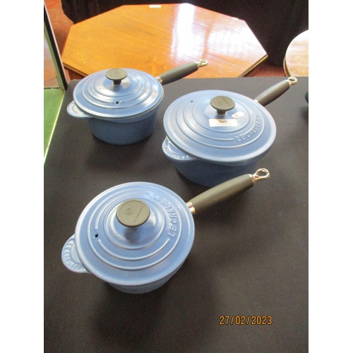 269 - A graduated set of three Le Creuset lidded saucepans