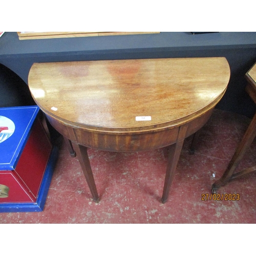 281 - An early nineteenth century mahogany demi lune tea table with fold over top