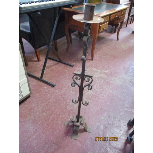 295 - A wrought iron candle stand of large proportion