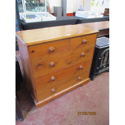 298 - A honey glazed pine chest of two short over three long drawers