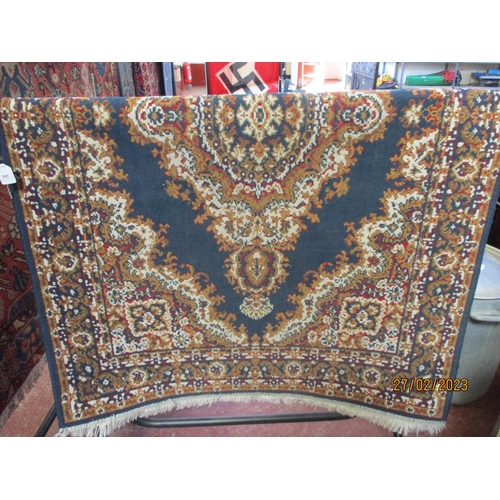 305 - An oriental floor rug on blue coloured ground