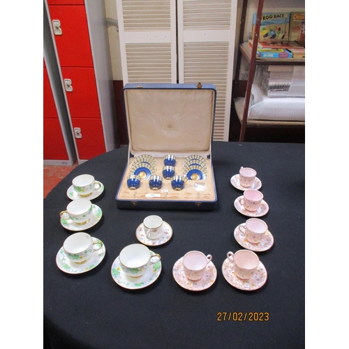 325 - A collection of Royal Worcester and Royal Doulton cups and saucers