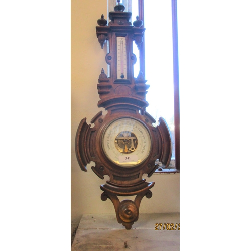 341 - An oak cased aneroid barometer