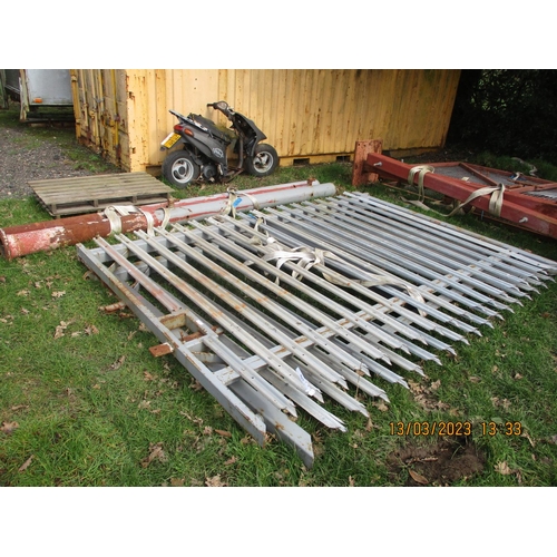 19 - A pair of steel and galvanised entrance gates complete with pillars (6.7m span approximately)