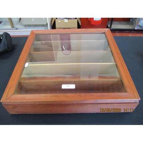 217 - A glazed wall mounted display cabinet