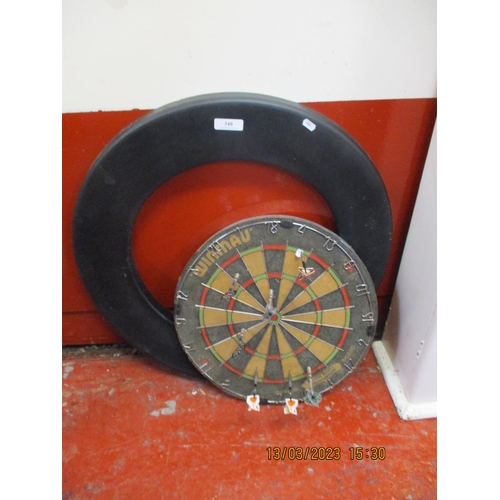 340 - A Windmau dartboard, darts and surround