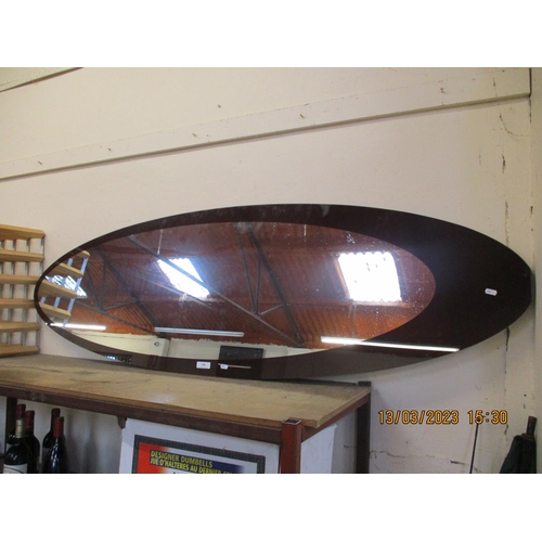 348 - A contemporary oval shaped wall mirror