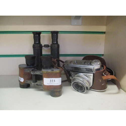 223 - Two pairs of vintage binoculars together with a vintage Kodak Retina automatic III camera