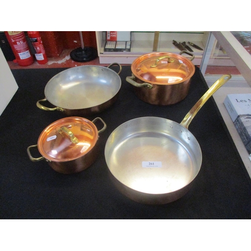 261 - Four pieces of copper and brass cook ware