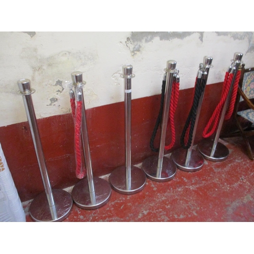 353 - A set of six chrome crowd control stanchions together with seven matching ropes