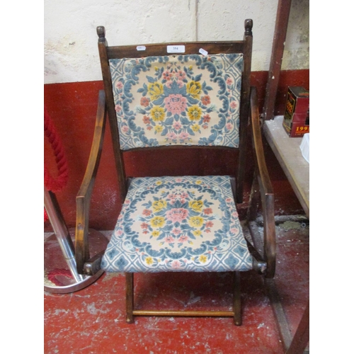 354 - An early twentieth century folding campaign chair