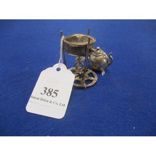 385 - A miniature continental silver teapot and stand