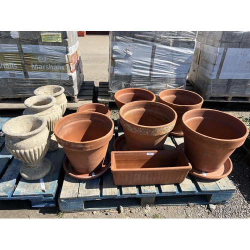 116 - Six terracotta plant pots each complete with saucer together with a terracotta plant trough