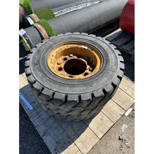 51 - A pair of forklift truck wheels fitted Michelin 7.00R12 tyres