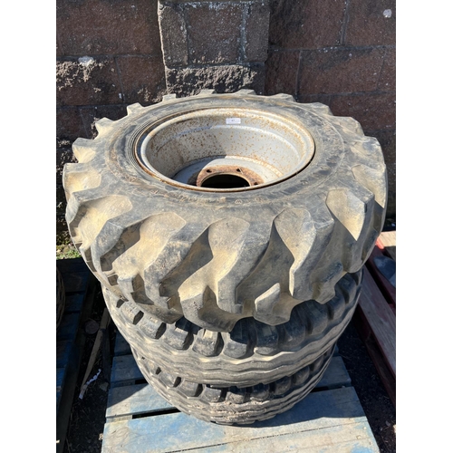 63 - A pair of 12.5/80-18 trailer/implement wheels and tyres together with one other (12.0/12.5-18)