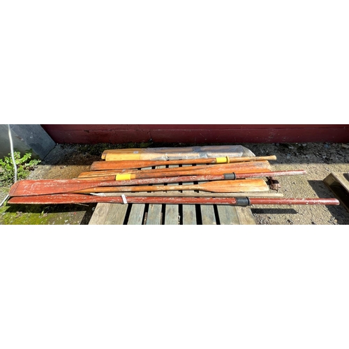 86 - Assorted wooden oars and a boat hook
