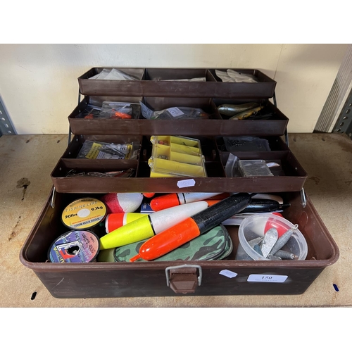 150 - A cantilever action tackle box containing a large assortment of fishing tackle