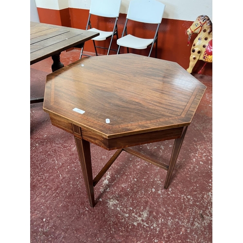 253 - An Edwardian inlaid octagonal window table