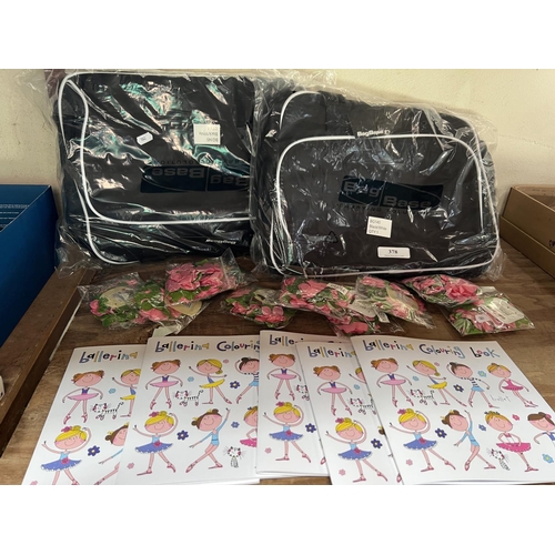 378 - Two bag base carrying solution bags together with several ballerina colouring books and several pack... 