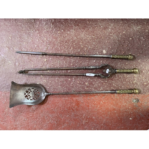 447 - A set of three vintage fire irons