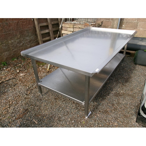 27 - A stainless steel preparation table fitted an under tier