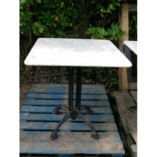 43 - A cast iron and marble top bistro table