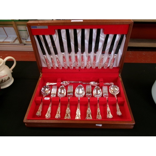 208 - A mahogany canteen of Kings pattern cutlery by Viners of Sheffield