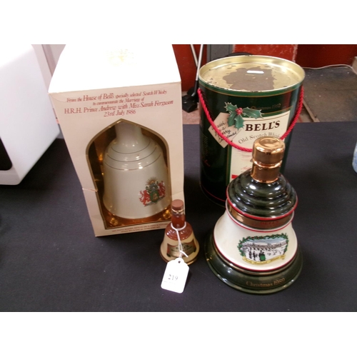 219 - Two Bell's commemorative whisky decanters together with another Bell's whisky decanter of diminutive... 