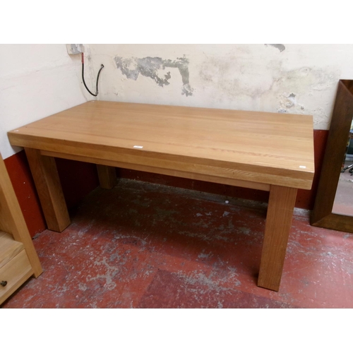 297 - A contemporary substantial solid oak dining table