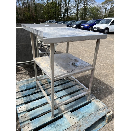 43 - A stainless steel equipment table fitted an under tier