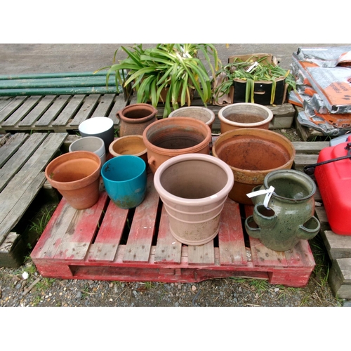 83 - A Strawberry planter together with an assortment of pots etc.