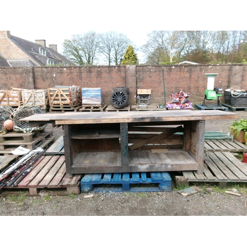 84 - A large and substantial wooden work bench