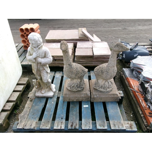 97 - Two large reconstituted stone models of geese  together with a reconstituted stone model of a boy