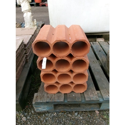 79 - Four terracotta wine racks