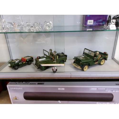 216 - Three tin plate models of jeeps