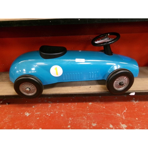 218 - A child's ride on blue racing car