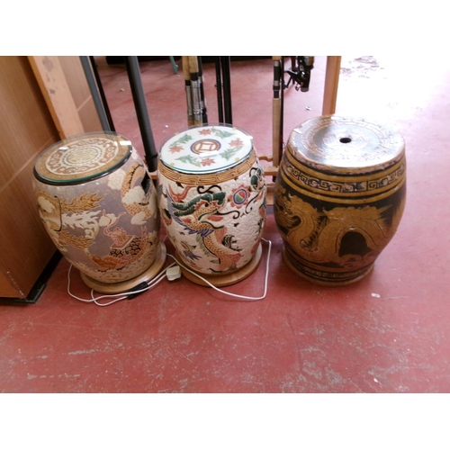 268 - Three oriental ceramic stools, two now wired for electricity