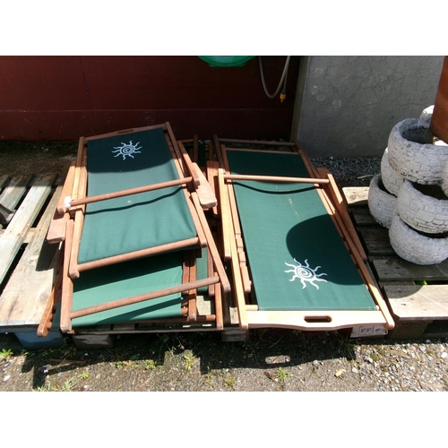 101 - A set of four hard wood deckchairs in the traditional style