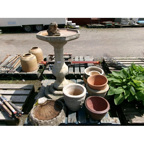 125 - A large reconstituted stone bird bath together with various other pots and planters