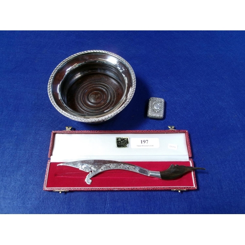 197 - A silver plated wine coaster, a silver and horn paperknife and a vesta case