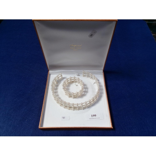 199 - A fresh water pearl choker necklace together with a matching cuff bracelet