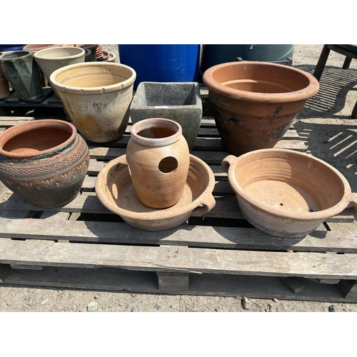 105 - Assorted terracotta and stone ware pots and planters