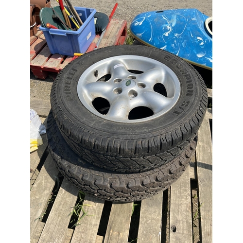 109 - An aluminium Land Rover wheel and tyre 215/R16 together with an LT235/85