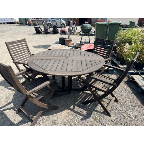 34 - A Pagoda Furniture circular patio table together with four matching chairs